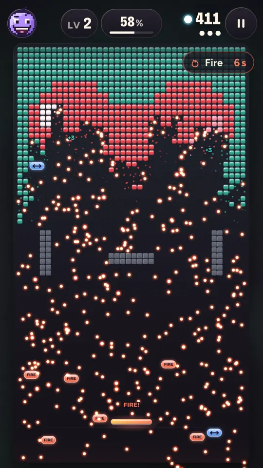 Catching capsules: hundreds of fire balls blast through a pixel heart, with FIRE and WIDE capsules falling